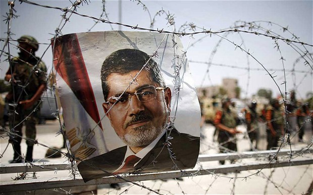 Egypt's Morsi says protests are 'useless' and warns Sisi could face a coup