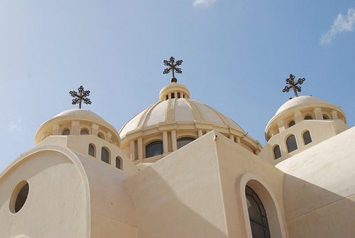 Coptic Catholics in Suez pray inside the burnt church  