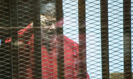 Morsi, Egypt's first former president to appear in red execution garb