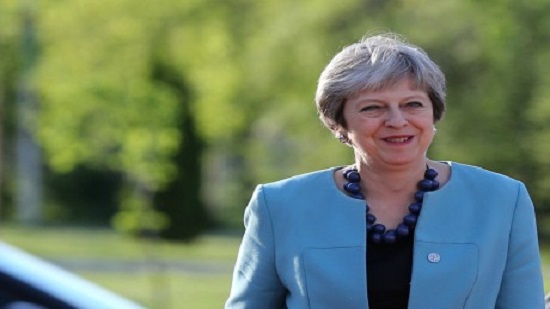 May says Britain will leave customs union, EU warns on Irish border again