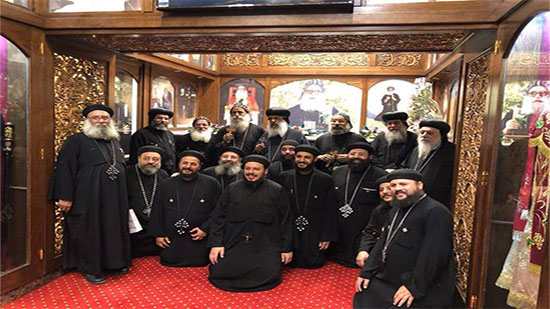 A group of clergymen visit the shrine of Bishop Arsanius