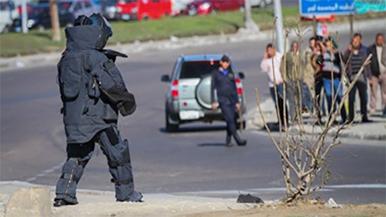 Police dismantle an explosive device near a church in Alexandria