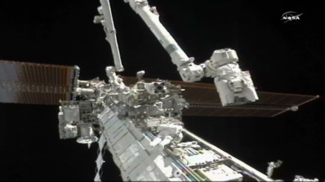 Astronauts begin spacewalk to fix cooling system