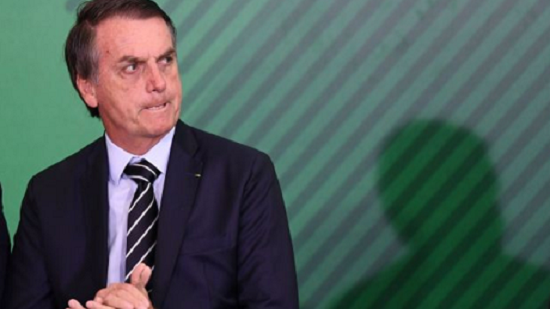 Brazil president sacks close aide amid political scandal