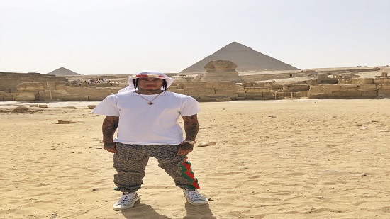 American rapper Tyga poses in front of Egypt’s Great Pyramids