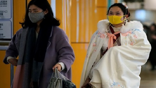 Chinas mask makers cancel holidays, jack up wages as new virus spurs frenzied demand