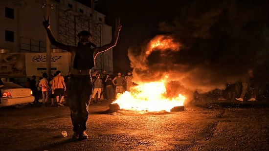 Officials say east Libya government resigns amid protests
