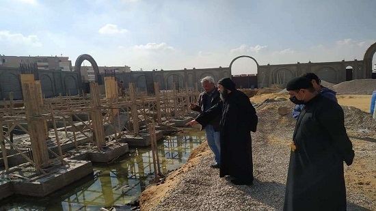 Bishop Bemwa follows the construction work in the Church of St. Mina and Pope Kyrollos
