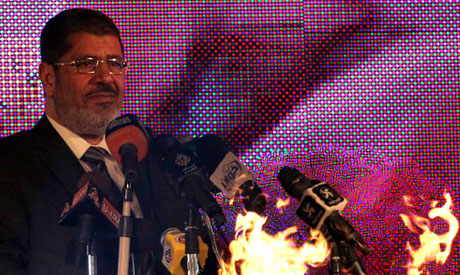 Brotherhood's Mursi appeals to revolution supporters against 'remnants of corrupt regime'