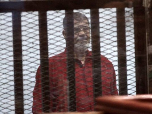 Morsi appears in death row jumpsuit in espionage trial
