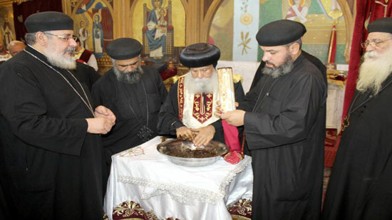Bishop of Ashmim perfumes the remains of St. Peter and Paul
