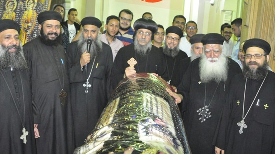 Bishop of Isna perfumes the remains of St Dolagi and her 4 children
