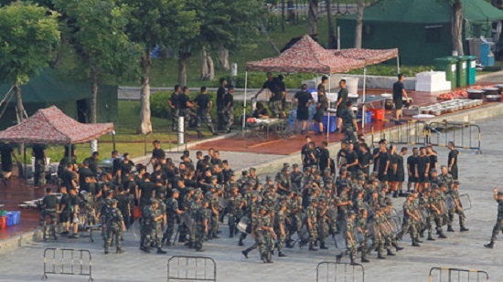 Chinese forces exercise across border as Hong Kong braces for protests