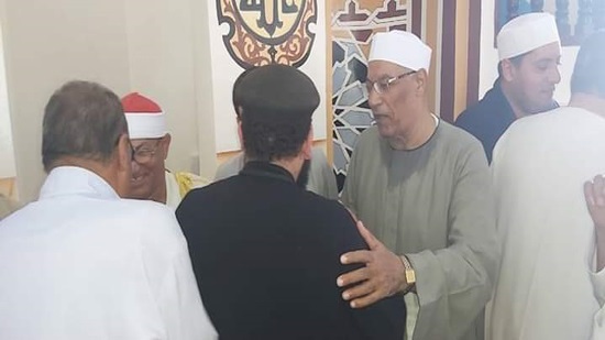 A Coptic priest participates in the opening of a mosque in Sharqiya 