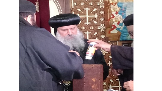 Bishop Markos perfumes the remains of St. Zakharias in Sakha