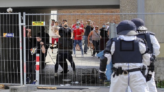 German police injured as clashes erupt over virus quarantine