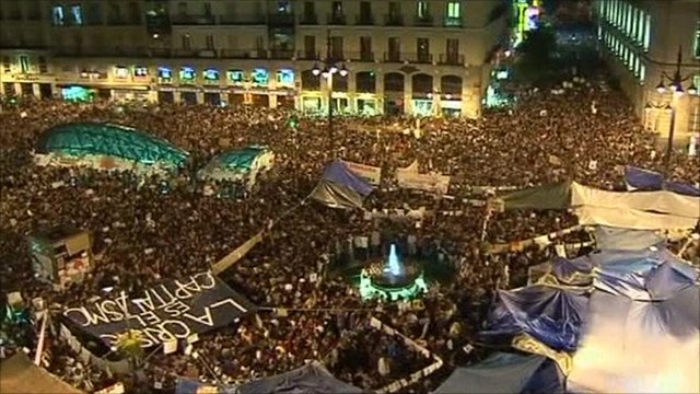 Spain protesters defy ban to remain in Madrid square
