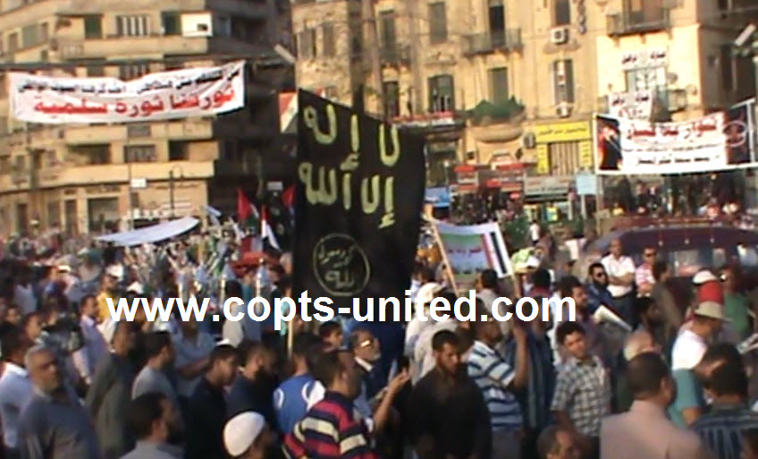 Abu Ismail supports carry the flag of al-Qaeda in Tahrir square