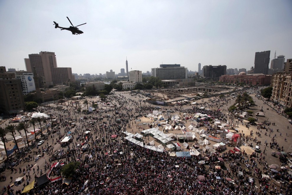 Military aircraft perform shows above Tahrir Square