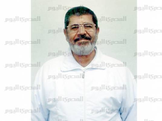 Exclusive photos: Morsy appears in white prison suit, smiling